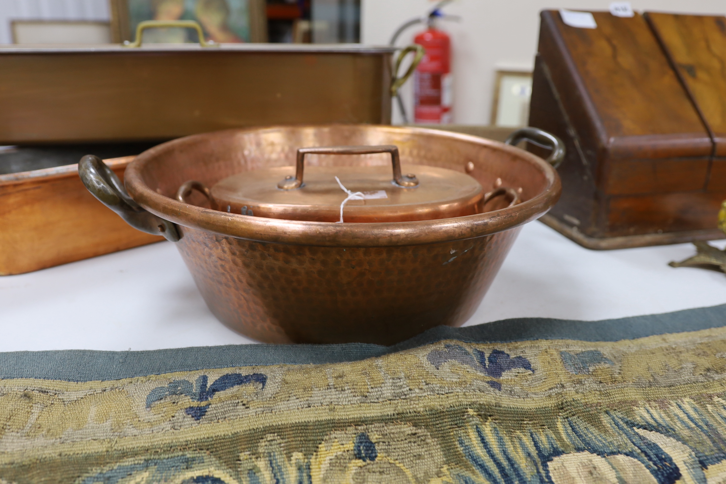 Two copper fish kettles, a casserole dish and cover and a jam making pot, a lidded fish kettle 68cm high